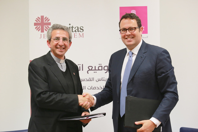 Bank of Palestine signs an agreement to support Caritas Jerusalem to buy a mobile clinic vehicle to provide health services to citizens in Gaza Strip